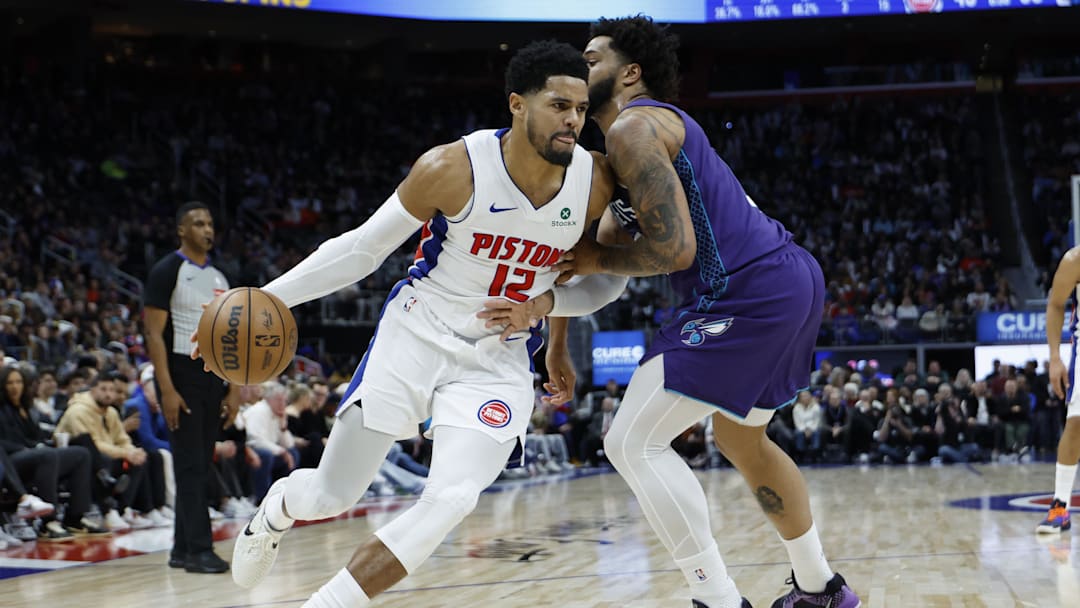 Detroit Pistons forward Tobias Harris (12) dribbles defended by Charlotte Hornets forward Miles Bridges 