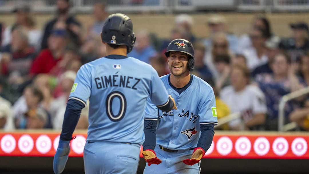 Jun 6, 2025; Minneapolis, Minnesota, USA; Toronto Blue Jays third baseman Ernie Clement (22) and Toronto Blue Jays second baseman Andres Gimenez (0) celebrate after scoring the go ahead runs against the Minnesota Twins in the fifth inning at Target Field. Mandatory Credit: Jesse Johnson-Imagn Images Jun 6, 2025; Minneapolis, Minnesota, USA; Toronto Blue Jays third baseman Ernie Clement (22) and Toronto Blue Jays second baseman Andres Gimenez (0) celebrate after scoring the go ahead runs against the Minnesota Twins in the fifth inning at Target Field. Mandatory Credit: Jesse Johnson-Imagn Images