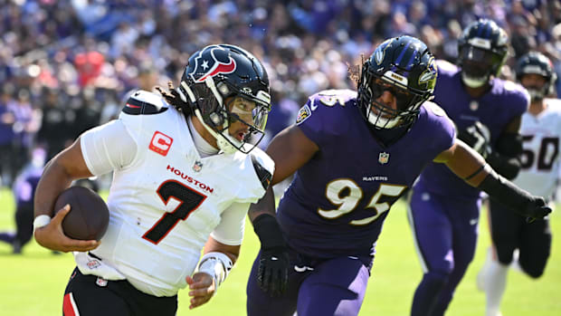 Oct 5, 2025; Baltimore, Maryland, USA; Houston Texans quarterback C.J. Stroud (7) runs for a gain past Baltimore Ravens