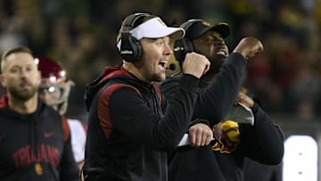 Nov 11, 2023; Eugene, Oregon, USA; USC Trojans head coach Lincoln Riley signals to the offense during the second half against the Oregon Ducks at Autzen Stadium. Mandatory Credit: Troy Wayrynen-Imagn Images