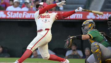 Jun 24, 2024; Anaheim, California, USA;  Los Angeles Angels left fielder Taylor Ward (3) hits a two-run home run in the first inning against the Oakland Athletics at Angel Stadium. Mandatory Credit: Jayne Kamin-Oncea-USA TODAY Sports