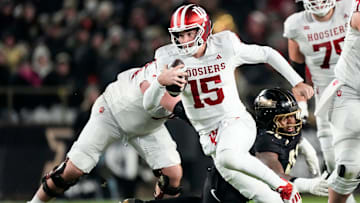 Indiana Hoosiers quarterback Fernando Mendoza (15) rushes up the field Friday, Nov. 28, 2025, during the 100th annual Old Oaken Bucket game at Ross-Ade Stadium in West Lafayette.