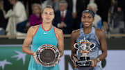Coco Gauff of the United States poses with Aryna Sabalenka after their match.