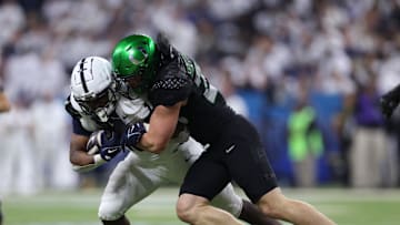 That's a wrap: Bryce Boettcher takes down Penn State's Nicholas Singleton in the Big Ten Championship Game. Ducks won, 45-37. Mandatory Credit: Jordan Prather-Imagn Images