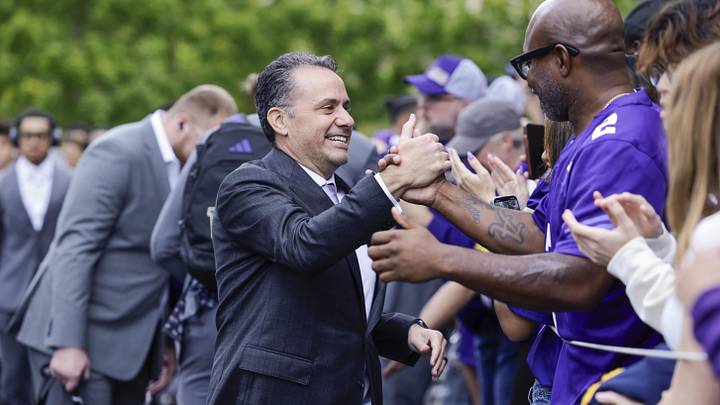 Sep 27, 2025; Seattle, Washington, USA; Washington Huskies head coach Jedd Fisch shakes hands with fans while walking into Husky Stadium before a game against the Ohio State Buckeyes. Mandatory Credit: Joe Nicholson-Imagn Images