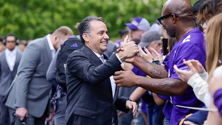 Sep 27, 2025; Seattle, Washington, USA; Washington Huskies head coach Jedd Fisch shakes hands with fans while walking into Husky Stadium before a game against the Ohio State Buckeyes. Mandatory Credit: Joe Nicholson-Imagn Images