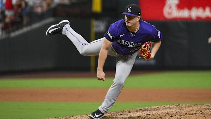 Aug 12, 2025; St. Louis, Missouri, USA;  Colorado Rockies relief pitcher Victor Vodnik (38) pitches against the St. Louis Cardinals during the ninth inning at Busch Stadium. 