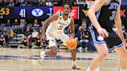 West Virginia University guard Toby Okani