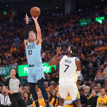 Apr 15, 2025; San Francisco, California, USA; Memphis Grizzlies guard Luke Kennard (10) makes a three-point basket over Golden State Warriors guard Buddy Hield (7) in the first quarter at the Chase Center. Mandatory Credit: Cary Edmondson-Imagn Images