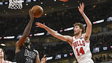 Dec 2, 2024; Chicago, Illinois, USA;  Brooklyn Nets center Day'Ron Sharpe (20) shoots against Chicago Bulls forward Matas Buzelis (14) 