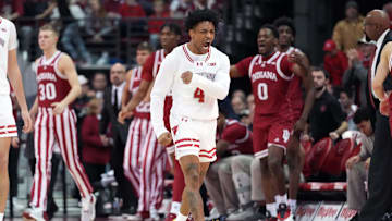 Jan 19, 2024; Madison, Wisconsin, USA; Wisconsin Badgers guard Kamari McGee (4) celebrates a Wisconsin Badgers basket against the Indiana Hoosiers during the second half at the Kohl Center. Mandatory Credit: Kayla Wolf-Imagn Images
