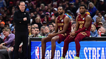 Apr 2, 2025; Cleveland, Ohio, USA;  Cleveland Cavaliers forward Evan Mobley (4) and guard Donovan Mitchell (45) wait along side head coach Kenny Atkinson to enter the game during the first half against the New York Knicks at Rocket Arena. Mandatory Credit: Ken Blaze-Imagn Images