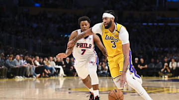 Nov 8, 2024; Los Angeles, California, USA; Los Angeles Lakers forward Anthony Davis (3) drives against Philadelphia 76ers guard Kyle Lowry (7) during the second half at Crypto.com Arena. Mandatory Credit: Jonathan Hui-Imagn Images