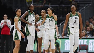 Jul 13, 2025; Seattle, Washington, USA; Seattle Storm guard Skylar Diggins (4), forward Ezi Magbegor (13), guard Tiffany Mitchell (25), forward Gabby Williams (5) and forward Nneka Ogwumike (3) talk following a fourth quarter  timeout against the Washington Mystics at Climate Pledge Arena. Mandatory Credit: Joe Nicholson-Imagn Images