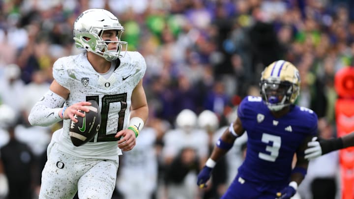 Oct 14, 2023; Seattle, Washington, USA; Oregon Ducks quarterback Bo Nix (10) looks to pass the ball during the first half against the Washington Huskies at Alaska Airlines Field at Husky Stadium. Mandatory Credit: Steven Bisig-USA TODAY Sports