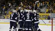 The Penn State Nittany Lions celebrate their win over the Michigan Wolverines in the Big Ten Men's Hockey Tournament.