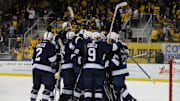 The Penn State Nittany Lions celebrate their win over the Michigan Wolverines in the Big Ten Men's Hockey Tournament.