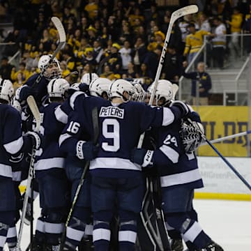 The Penn State Nittany Lions celebrate their win over the Michigan Wolverines in the Big Ten Men's Hockey Tournament.