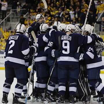 The Penn State Nittany Lions celebrate their win over the Michigan Wolverines in the 2025 Big Ten Hockey Tournament. 