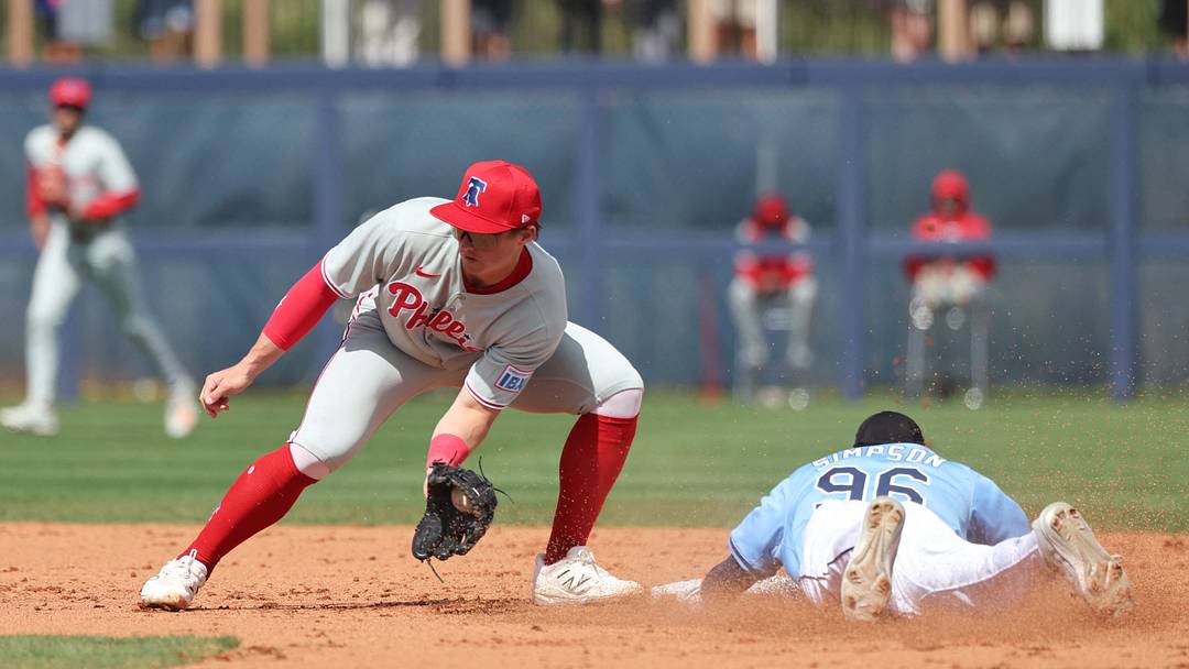 Feb 25, 2025; Port Charlotte, Florida, USA; Tampa Bay Rays outfielder Chandler Simpson (96) slides safely into second base against Philadelphia Phillies infielder Aidan Miller (81) at Charlotte Sports Park. Mandatory Credit: Kim Klement Neitzel-Imagn Images Feb 25, 2025; Port Charlotte, Florida, USA; Tampa Bay Rays outfielder Chandler Simpson (96) slides safely into second base against Philadelphia Phillies infielder Aidan Miller (81) at Charlotte Sports Park. Mandatory Credit: Kim Klement Neitzel-Imagn Images