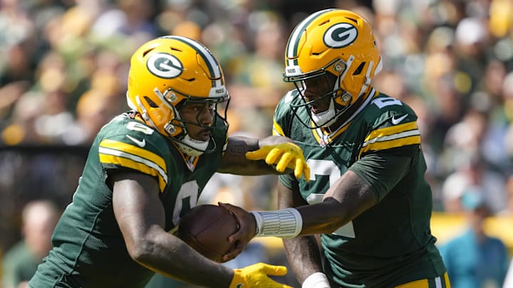 Sep 15, 2024; Green Bay, Wisconsin, USA;  Green Bay Packers quarterback Malik Willis (2) hands the football off to running back Josh Jacobs (8) during the second quarter against the Indianapolis Colts at Lambeau Field. Mandatory Credit: Jeff Hanisch-Imagn Images