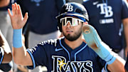 Sep 28, 2025; Toronto, Ontario, CAN;  Tampa Bay Rays designated hitter Jonathan Aranda (62) celebrates in the dugout after scoring a run against the Toronto Blue Jays in the third inning at Rogers Centre. 