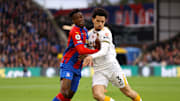Zaha and Ait-Nouri compete for the ball