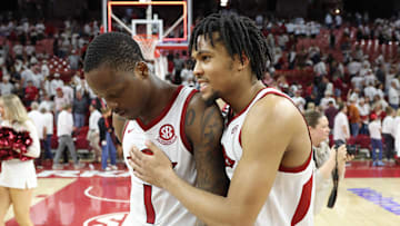Feb 26, 2025; Fayetteville, Arkansas, USA; Arkansas Razorbacks guards Johnell Davis (1) and D.J. Wagner (21) celebrate after an overtime win against the Texas Longhorns at Bud Walton Arena. Mandatory Credit: Nelson Chenault-Imagn Images