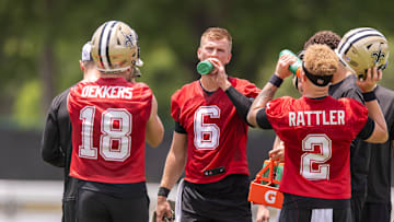 Jun 10, 2025; New Orleans, LA, USA;  New Orleans Saints quarterback Tyler Shough (6) and quarterback Spencer Rattler (2) and quarterback Hunter Dekkers (18) take a water break during minicamp at Ochsner Sports Performance Center. Mandatory Credit: Stephen Lew-Imagn Images