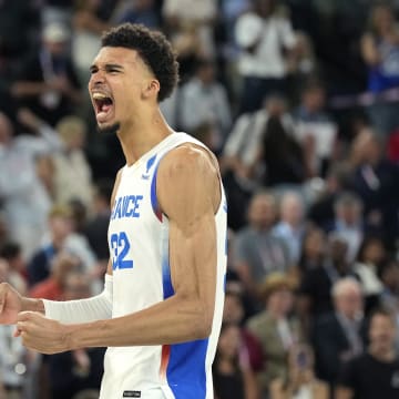 Aug 8, 2024; Paris, France; France power forward Victor Wembanyama (32) celebrates after the game against Germany in a men's basketball semifinal game during the Paris 2024 Olympic Summer Games at Accor Arena. Mandatory Credit: Kyle Terada-USA TODAY Sports