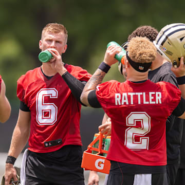Jun 10, 2025; New Orleans, LA, USA;  New Orleans Saints quarterback Tyler Shough (6) and quarterback Spencer Rattler (2) and quarterback Hunter Dekkers (18) take a water break during minicamp at Ochsner Sports Performance Center. Mandatory Credit: Stephen Lew-Imagn Images