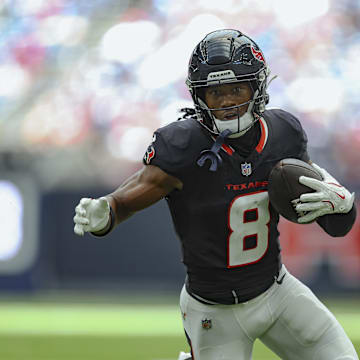 Aug 17, 2024; Houston, Texas, USA; Houston Texans wide receiver John Metchie III (8) runs with the ball after a reception during the game against the New York Giants at NRG Stadium. Mandatory Credit: Troy Taormina-Imagn Images