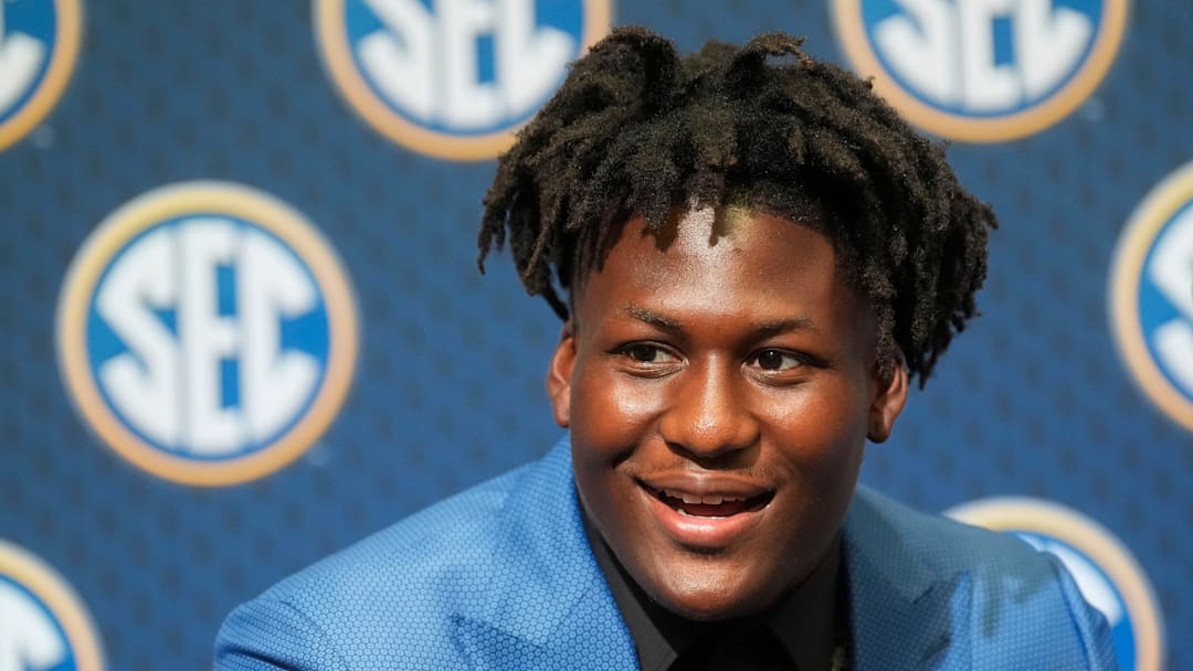 Texas player Anthony Hill Jr. smiles as he answers questions during SEC Media Days.