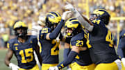 Oct 18, 2025; Ann Arbor, Michigan, USA;  Michigan Wolverines linebacker Cole Sullivan (23) celebrates after he makes an interception in the second half at Michigan Stadium. Mandatory Credit: Rick Osentoski-Imagn Images