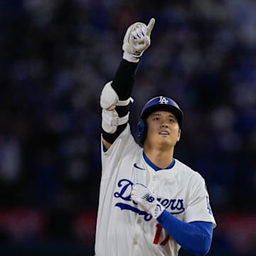 May 15, 2025; Los Angeles, California, USA; Los Angeles Dodgers designated hitter Shohei Ohtani (17) celebrates as he rounds the bases after hitting a three-run home run against the Athletics during the third inning of the game at Dodger Stadium. Mandatory Credit: Jayne Kamin-Oncea-Imagn Images