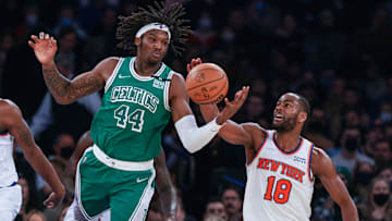 Jan 6, 2022; New York, New York, USA; Boston Celtics center Robert Williams III (44) reaches for loose ball against New York Knicks guard Alec Burks (18) during the first half at Madison Square Garden. Mandatory Credit: Vincent Carchietta-Imagn Images