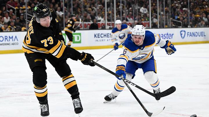 Apr 23, 2026; Boston, Massachusetts, USA; Boston Bruins defenseman Charlie McAvoy (73) clears the puck against Buffalo Sabres left wing Zach Benson (6) during the second period of game three of the first round of the 2026 Stanley Cup Playoffs at the TD Garden. Mandatory Credit: Brian Fluharty-Imagn Images Apr 23, 2026; Boston, Massachusetts, USA; Boston Bruins defenseman Charlie McAvoy (73) clears the puck against Buffalo Sabres left wing Zach Benson (6) during the second period of game three of the first round of the 2026 Stanley Cup Playoffs at the TD Garden. Mandatory Credit: Brian Fluharty-Imagn Images