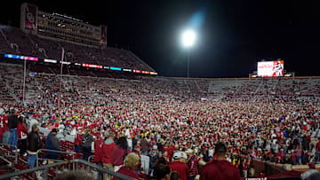 Fans rush the field after a college football game between the University of Oklahoma Sooners (OU) and the Alabama Crimson Tide at Gaylord Family - Oklahoma Memorial Stadium in Norman, Okla., Saturday, Nov. 23, 2024. Oklahoma won 24-3.