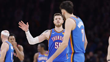 Feb 7, 2025; Oklahoma City, Oklahoma, USA;Oklahoma City Thunder center Isaiah Hartenstein (55) gestures towards forward Chet Holmgren (7) after a play against the Toronto Raptors during the second half at Paycom Center. Mandatory Credit: Alonzo Adams-Imagn Images