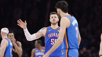 Feb 7, 2025; Oklahoma City, Oklahoma, USA;Oklahoma City Thunder center Isaiah Hartenstein (55) gestures towards forward Chet Holmgren (7) after a play against the Toronto Raptors during the second half at Paycom Center. Mandatory Credit: Alonzo Adams-Imagn Images