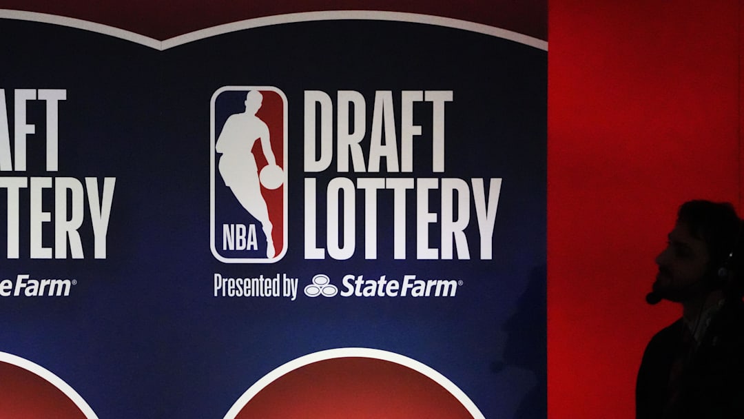 May 12, 2025; Chicago, Illinois, US; A person watches the 2025 NBA Draft Lottery at McCormick Place. Mandatory Credit: David Banks-Imagn Images