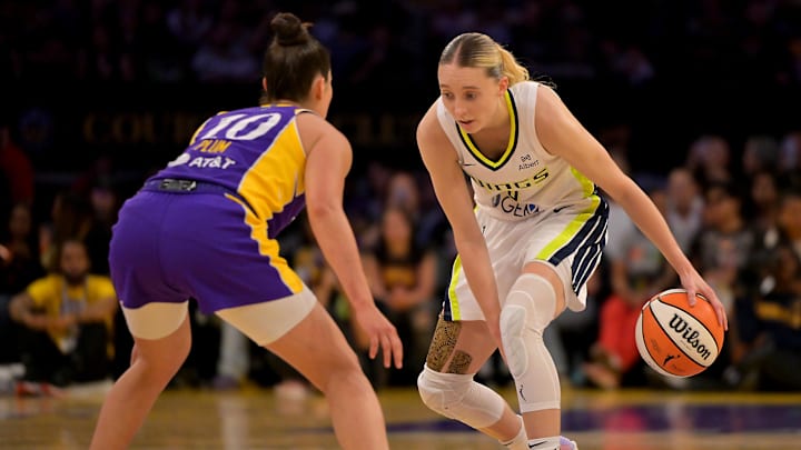Sep 7, 2025; Los Angeles, California, USA;  Los Angeles Sparks guard Kelsey Plum (10) defends Dallas Wings guard Paige Bueckers (5) as she drives to the basket during the first half at Crypto.com Arena. Mandatory Credit: Jayne Kamin-Oncea-Imagn Images