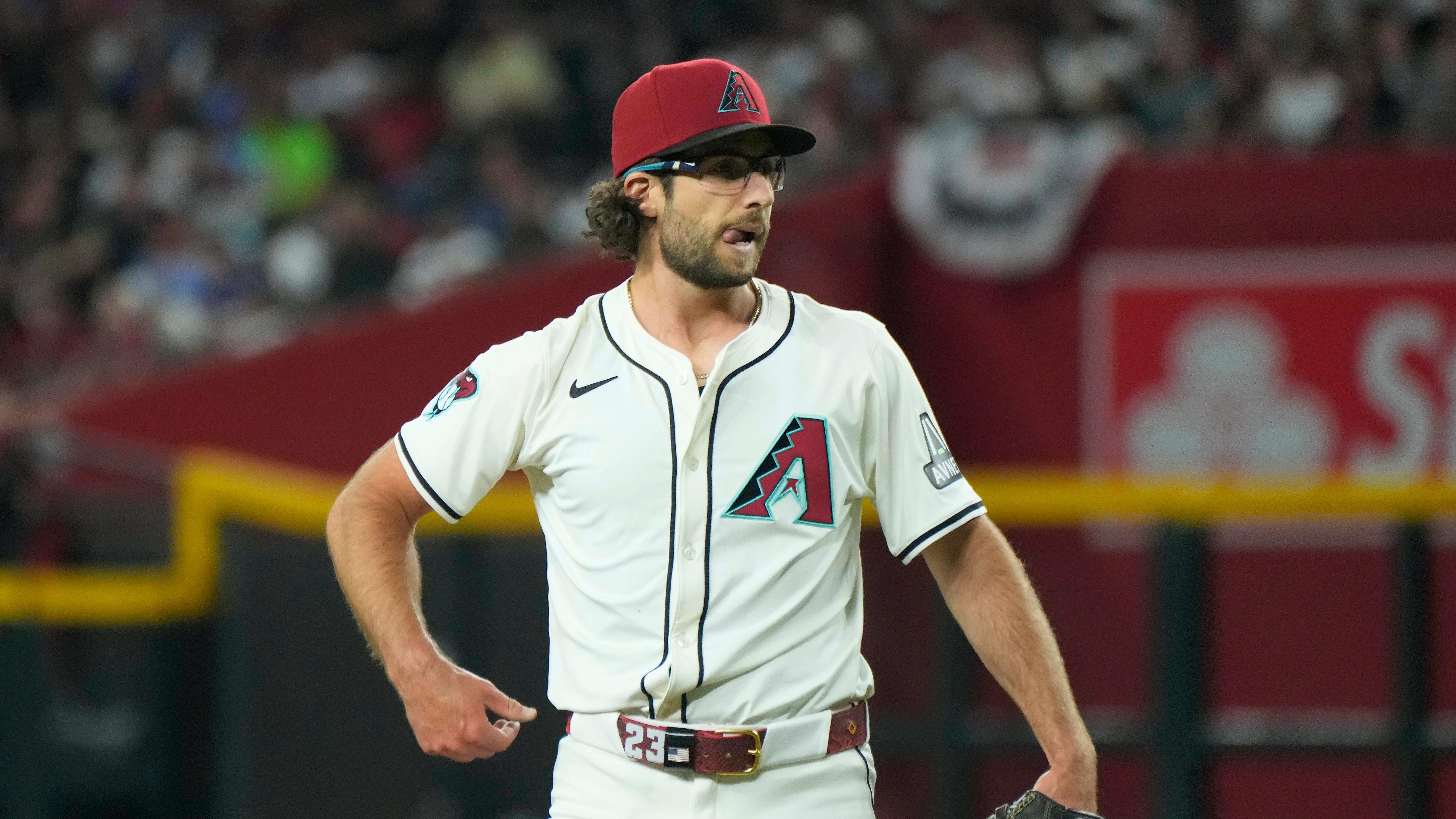 Diamondbacks pitcher Zac Gallen reacts to a called ball four against the Rockies during Opening Day.