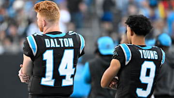 Nov 3, 2024; Charlotte, North Carolina, USA; Carolina Panthers quarterback Andy Dalton (14) and quarterback Bryce Young (9) on the sidelines in the fourth qarter at Bank of America Stadium. Mandatory Credit: Bob Donnan-Imagn Images