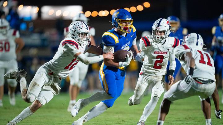 DCA's Carson Sneed (2) runs after a catch as Tipton-Rosemark's Tanner Thornell (12) tries to tackle him during their Division II-A playoff game at Donelson Christian Academy in Nashville, Tenn., Friday, Nov. 8, 2024.