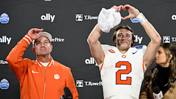 Dec 7, 2024; Charlotte, NC, USA; Clemson Tigers head coach Dabo Swinney, and quarterback Cade Klubnik (2) celebrate after winning the 2024 ACC Championship game against the Southern Methodist Mustangs at Bank of America Stadium. Mandatory Credit: Bob Donnan-Imagn Images
