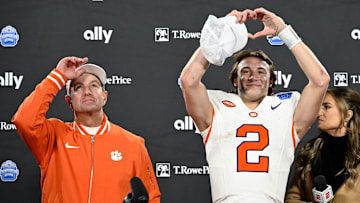 Dec 7, 2024; Charlotte, NC, USA; Clemson Tigers head coach Dabo Swinney, and quarterback Cade Klubnik (2) celebrate after winning the 2024 ACC Championship game against the Southern Methodist Mustangs at Bank of America Stadium. Mandatory Credit: Bob Donnan-Imagn Images