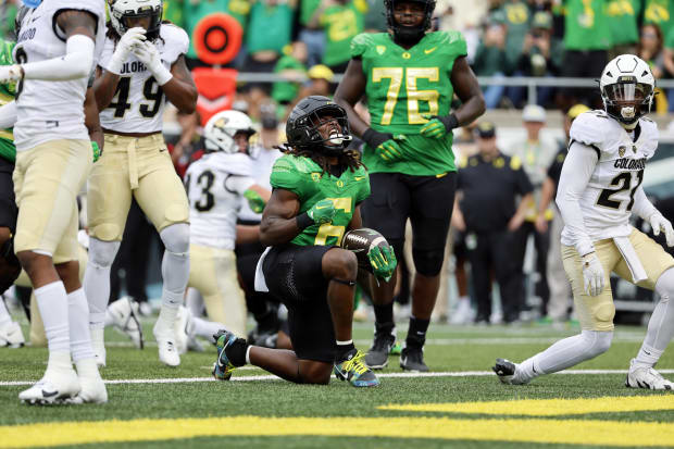 Oregon Ducks running back Noah Whittington celebrates after a touchdown.