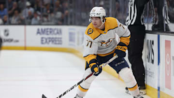 Apr 10, 2025; Salt Lake City, Utah, USA; Nashville Predators right wing Luke Evangelista (77) skates with the puck against the Utah Hockey Club during the first period at Delta Center. Mandatory Credit: Rob Gray-Imagn Images