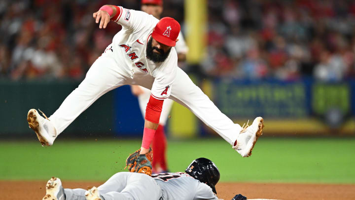 Jun 29, 2024; Anaheim, California, USA; Los Angeles Angels second baseman Luis Guillorme (15) tags Detroit Tigers outfielder Riley Greene (31) during the ninth inning at Angel Stadium.